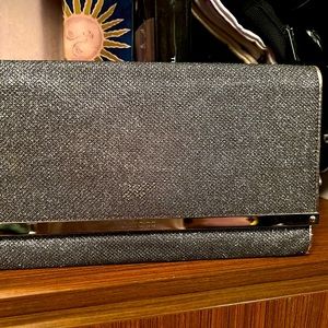 Jimmy Choo night out purse!holds more than it looks like.Efficient and cool.